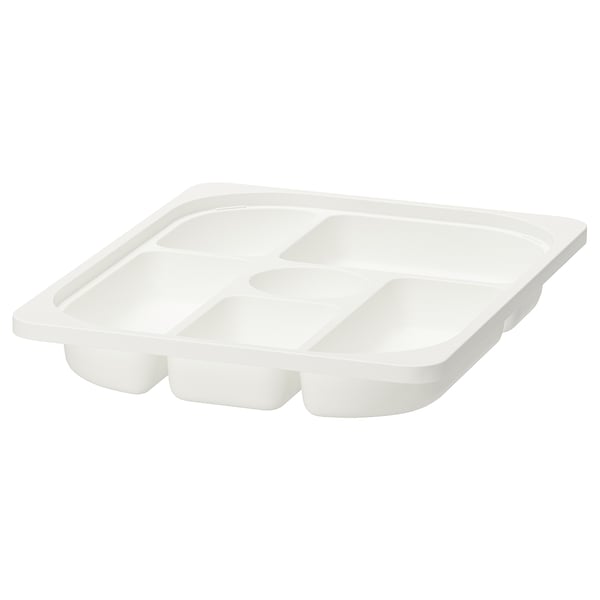 A white TROFAST storage tray with multiple compartments. Made of durable recycled plastic, it is designed for organizing small items.