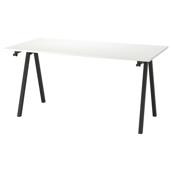 A white TROTTEN desk with black metal a-frame legs, offering a sturdy and modern design.