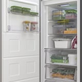Open freezer displaying organized containers with frozen food; includes integrated light and smart storage compartments.