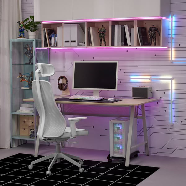 Gaming desk with led lights, durable, elevated, ample storage. Mesh chair adjusts, futuristic setup.