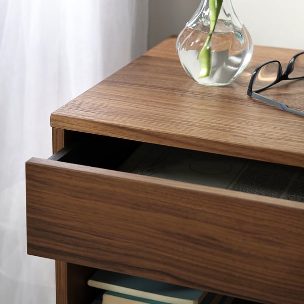 Modern bedside table with walnut veneer and metal underframe. Soft-close drawer open, showcasing quality craftsmanship and elegant design.