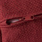 Close-up of red, textured fabric with zipper detail. Sewing indicates high-quality construction.