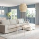 VIMLE sofa in cream with light blue walls, large window, rug, plants, and unique hanging lamp.