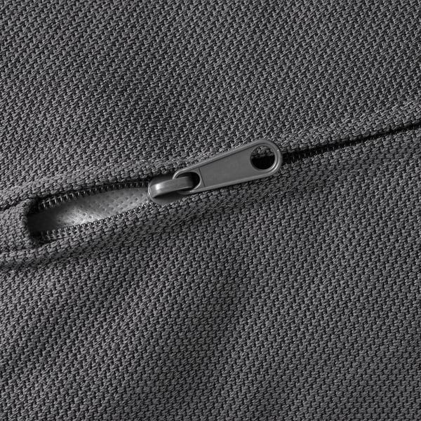 Zipper on textured gray fabric, smooth and sturdy metal slider, quality closure detail.