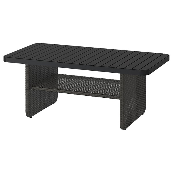 Black VITTSKÄR coffee table with rectangular slatted top and woven base, ideal for outdoor use.