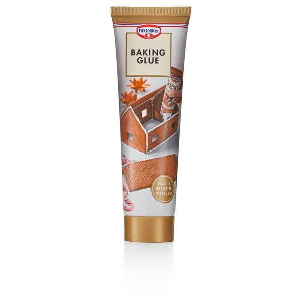 Putki dr. Oetker-leivontaliima, piparkakkutalojen koristeluun tarkoitettu ruoka-aine, pystyasennossa.