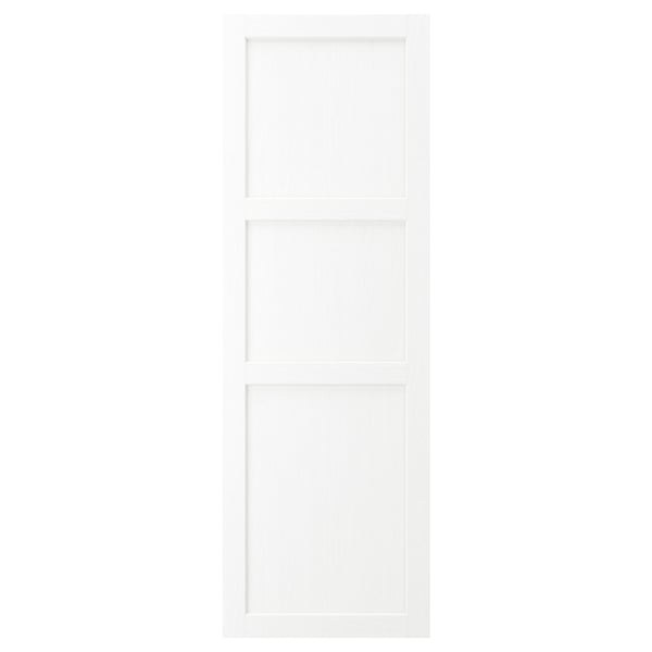 Valkoinen ENKÖPING-kaapin ovi klassisella muotoilulla. Sillä on sileä, puinen ulkonäkö, kehystetty muovireunuksella ja hienovarainen syyrakenne.