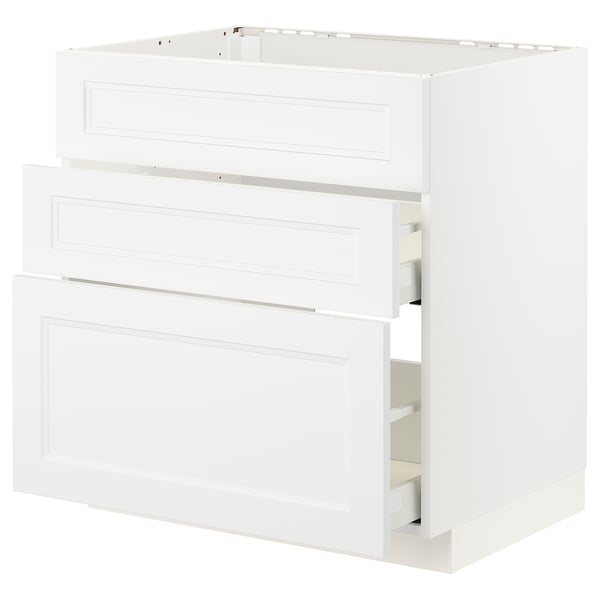 Valkoinen moderni keittiön kaappi kolmella laatikolla.