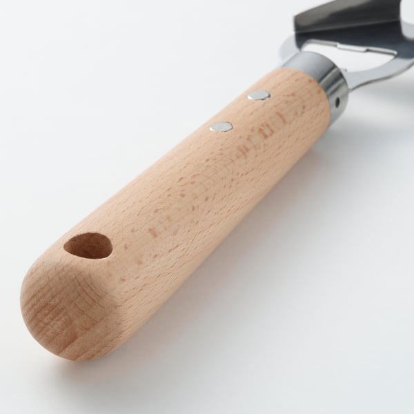 VARDAGEN: kestävä avaaja, jossa on sileä puinen kahva ja metalliset yksityiskohdat, suunniteltu kestämään ja mukavaksi.