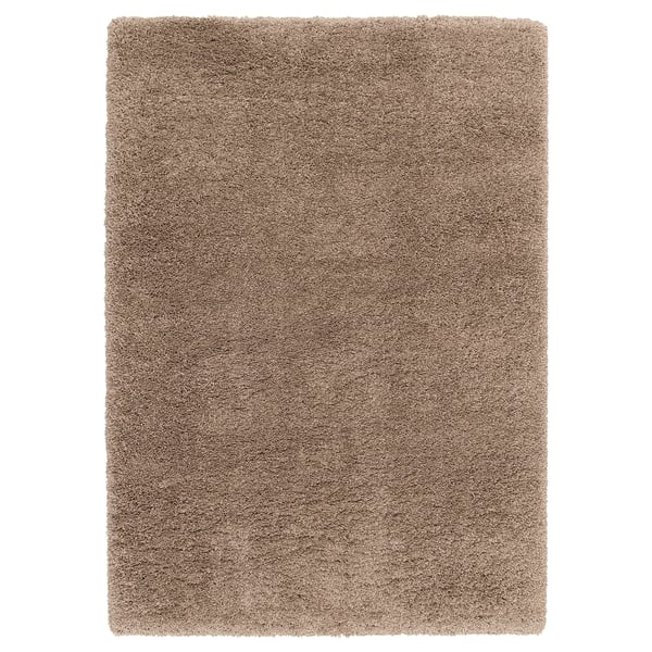 VOLLERSLEV takkuinen beige aluematto, jossa on vaihtelevan langan paksuus, joka tarjoaa pehmeän tekstuurin ja ääntä vaimentavat ominaisuudet.