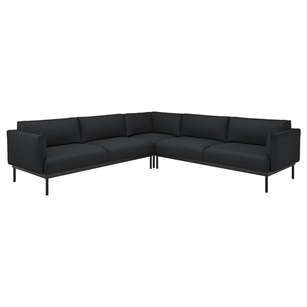 Mörkgrå modern hörnsoffa, minimalistisk design med metallben, plyschkuddar.