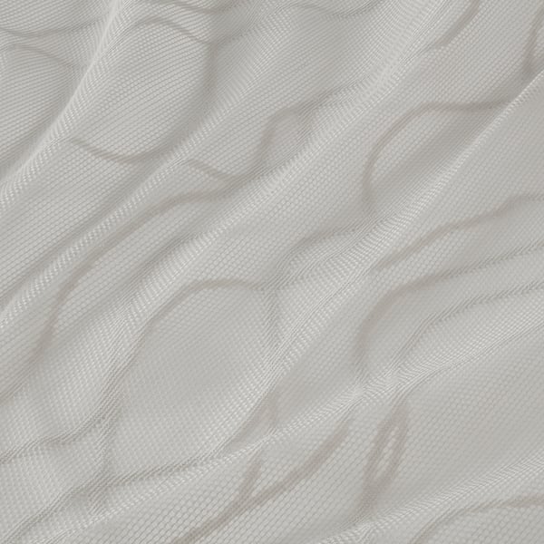 Mjuka, skira grå gardiner med eleganta vågor som ger avskildhet samtidigt som de släpper in ljus.