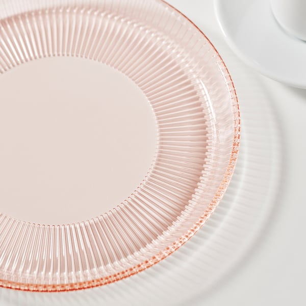 Datering - närbild av en rosa, räfflad glasplatta; visar klarhet och textur.