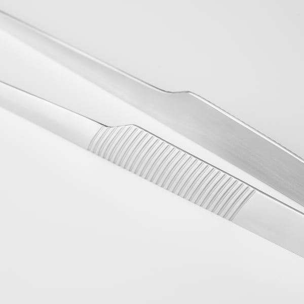Matlagningspincett i rostfritt stål; elegant, detaljerad greppstruktur; Perfekt för köksbruk.