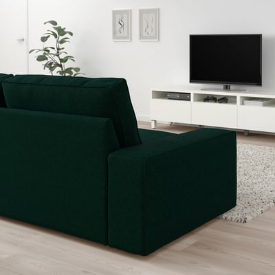 Smaragd KIVIK soffa, vit tv-bänk, minimalistisk inredning.