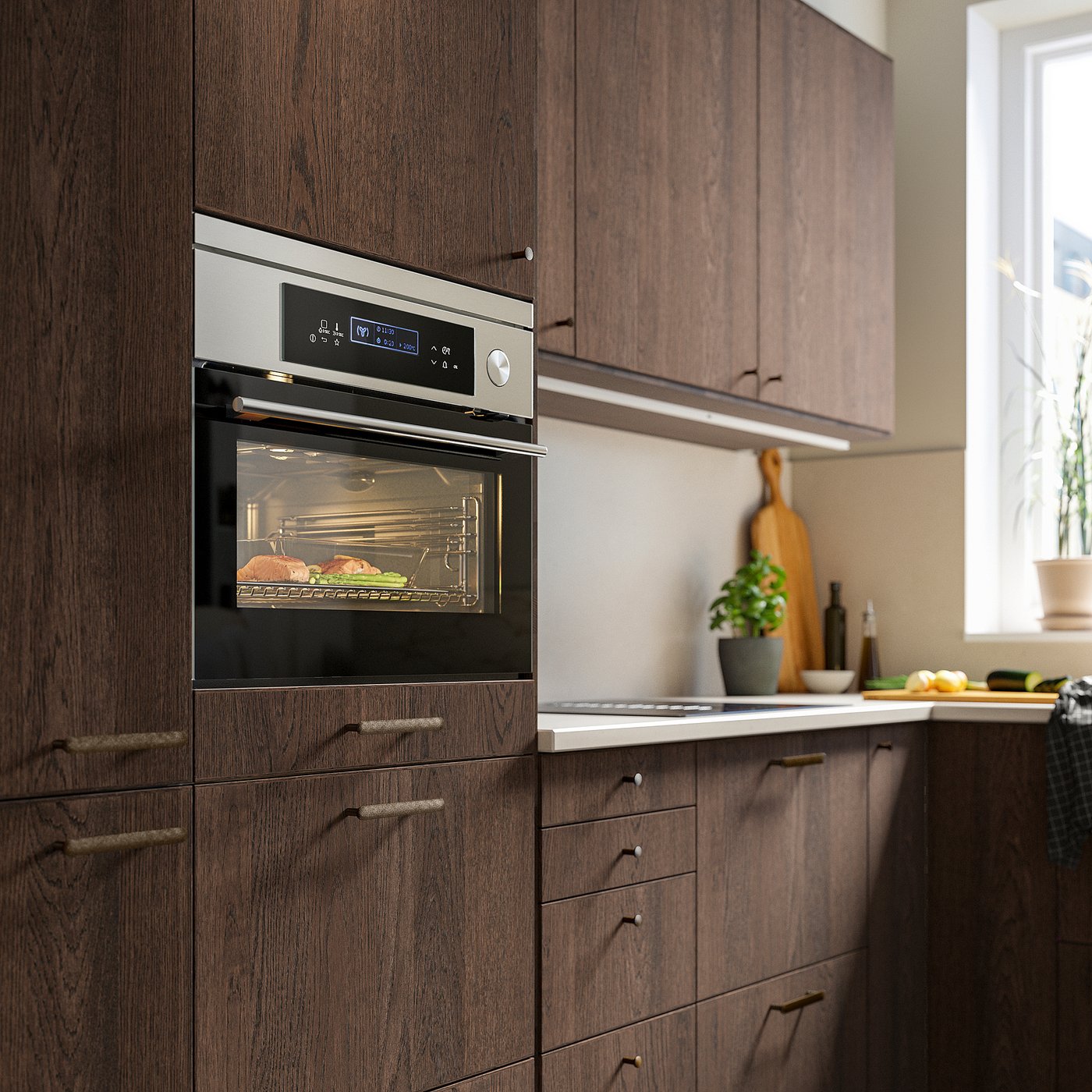Modernt kök med skåp i mörkt trä, inbyggd ugn och bänkskivor.