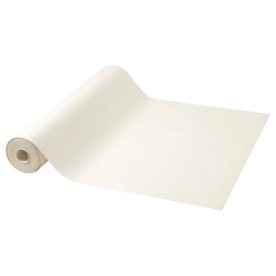 Rulle med beige ritpapper, stort, platt ark, ena änden böjd.