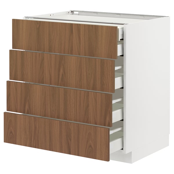 Modern vit köksdel med fyra trälådor, elegant design.