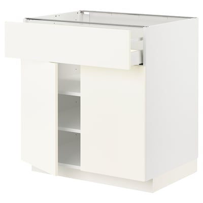 Ett vitt METOD köksskåp med en slät låda. Det har en elegant, modern design med en enda justerbar hylla inuti.