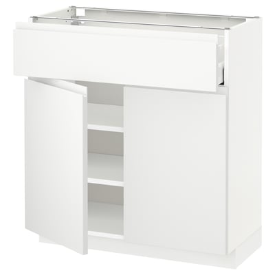 Vitt modernt köksskåp med låda, justerbara hyllor och minimalistisk design.