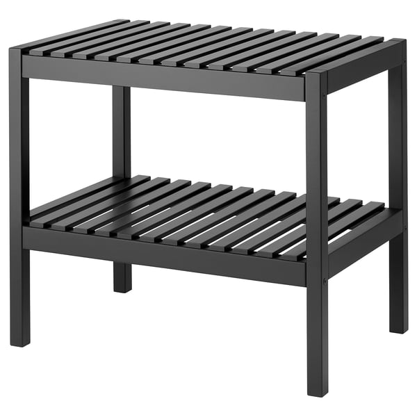 En förvaringsbänk i trä som heter MUSKAN. Den är mörkgrå, rektangulär, med två öppna hyllor för förvaring, lämplig för områden med hög luftfuktighet.