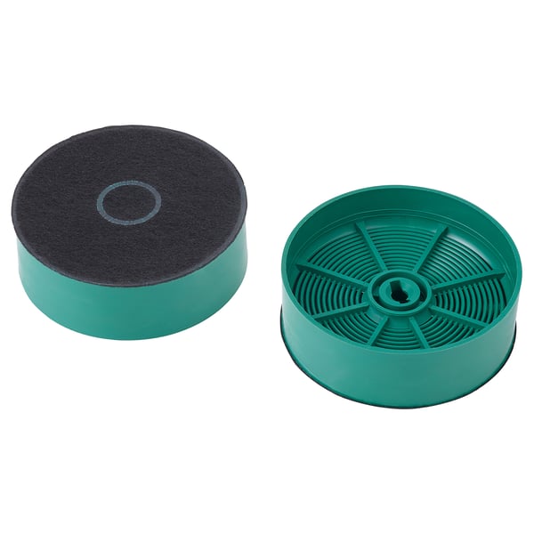 Två runda gröna kolfilter, ett med svart kol exponerat på toppen, designat för att återcirkulera matlagningsdofter.