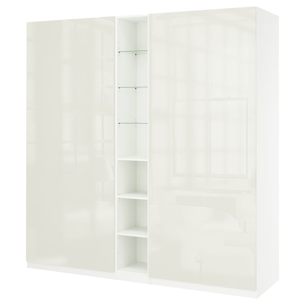 En vit IKEA PAX garderob med hyllor i elegant och modern design.