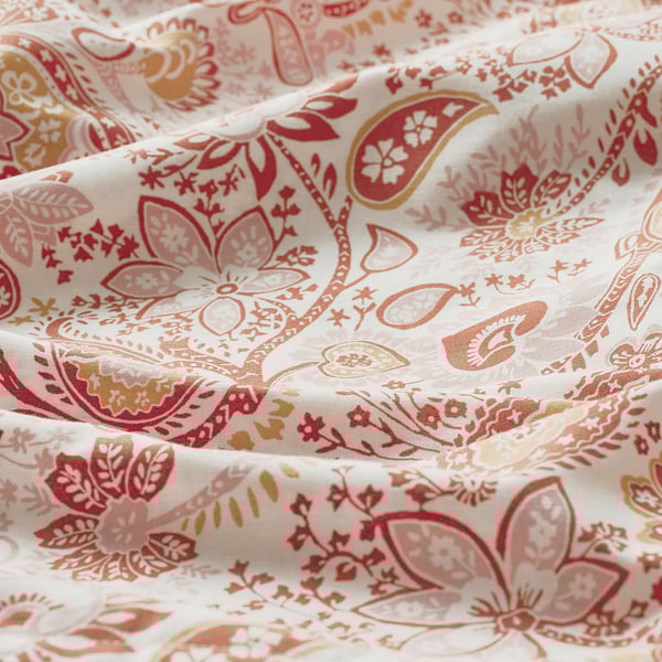 Intrikata paisley- och blommiga mönster på mjukt, glänsande tyg, 80 % bomull och 20 % viskos.