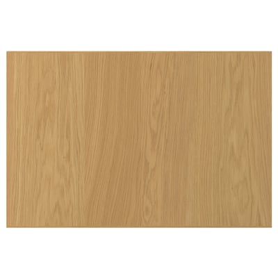 En SINARP trädörr i ekfanér med naturlig finish. Den har en enkel, rektangulär design med en massiv ekkant för stabilitet.