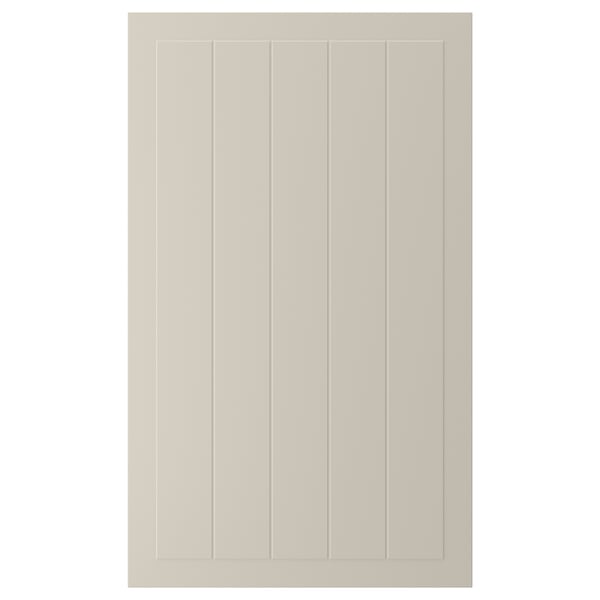 Visar en beige STENSUND skåpdörr med vertikala spår och en rektangulär ram, gjord av fiberplatta, motståndskraft mot fukt och fläckar.
