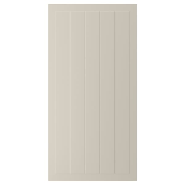 En beige STENSUND skåpdörr med en inramad, räfflad paneldesign. Dörren har en slät, lackerad yta.