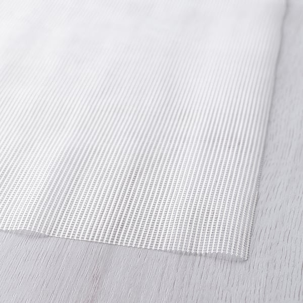 Närbild av texturerat halkskyddsunderlag, som visar intrikata mönster för säkert grepp.