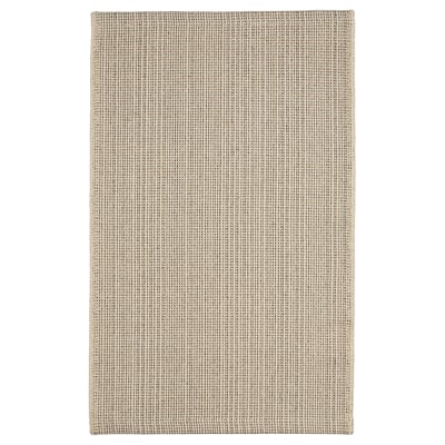 Flatvävd beige bomullsmatta, rutmönster, rektangulär form.