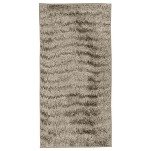 TOFTBO badrumsmatta, beige. Rektangulär, texturerad mikrofiber, mjuk och snabbtorkande.