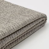 Vikt randigt tyg, troligen TONSTAD, som visar texturerad väv med vertikala linjer, verkar slitstarkt och mjukt, perfekt för överdrag.
