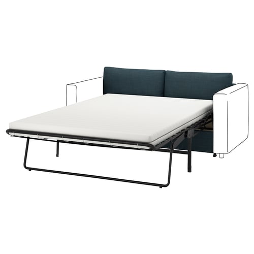 En blågrön VIMLE bäddsoffa med en vit madrass, som stöds av svarta metallben, erbjuder en elegant och modern design.