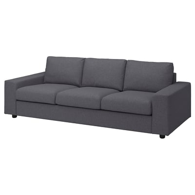 Modern mörkgrå 3-sits soffa, stilren design, mjukt tyg, fyrkantiga dynor.