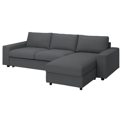 VIMLE mörkgrå l-formad bäddsoffa med mjuka linjer och mjuka kuddar.