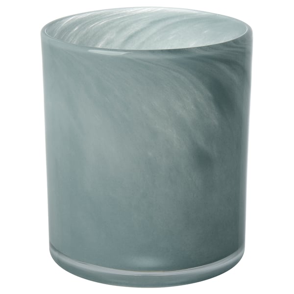 Rund, frostad blågrön ljusstake i glas. Handgjord med en vågig, strukturerad design.