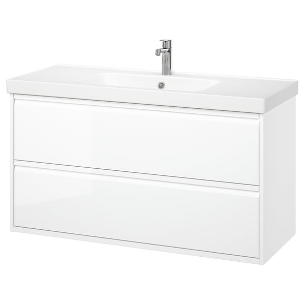 Meuble-lavabo blanc moderne avec un design élégant, deux tiroirs spacieux et des poignées intégrées, avec un évier en céramique avec robinet chromé.