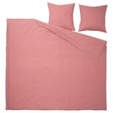 Parure de lit en coton rose, comprenant couette et oreillers avec fermeture enveloppe.