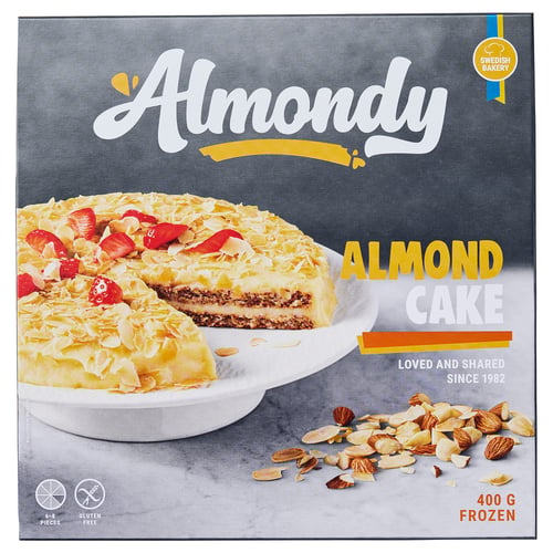 Boîte à gâteau aux amandes AMANDÉES - 400g, tranche de gâteau aux amandes, gâteau entier aux fraises, amandes éparpillées.