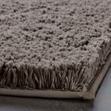 Tapis de bain doux et moelleux avec microfibre ultra-absorbante, support en latex sécurisé.