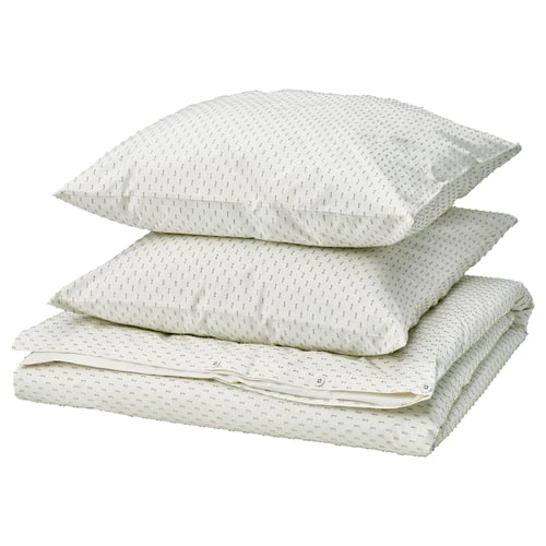Un ensemble de housse de couette BANDKNIPPE blanche avec des détails tissés verts, avec un dos lisse et un devant texturé, en 100 % coton.