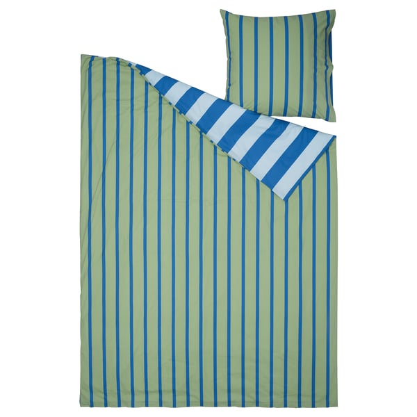 Parure de lit à rayures vertes et bleues avec oreiller.