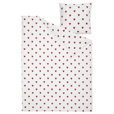 Ensemble de couette et d’oreiller blanc à motifs de cœurs avec des cœurs rouges. Fabriqué en coton doux, idéal pour les lits d’enfants.