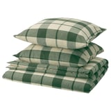 Parure de lit pliée à carreaux verts et blancs, composée de taies d’oreiller et d’une housse de couette en flanelle 100 % coton.