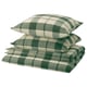 Parure de lit pliée à carreaux verts et blancs, composée de taies d’oreiller et d’une housse de couette en flanelle 100 % coton.