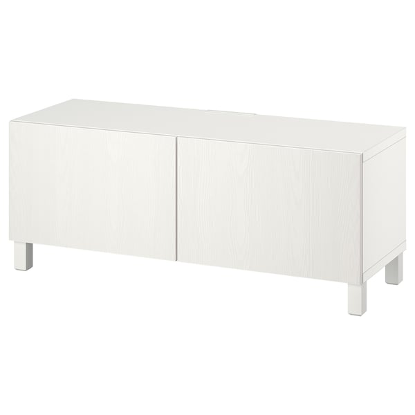Meuble TV BESTÅ, blanc, rectangulaire, avec quatre portes et pieds carrés, design élégant et moderne.