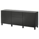 Un buffet ikea BESTÅ noir à trois sections : deux armoires et un tiroir, au design épuré et moderne.